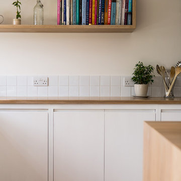 Minimalist White Kitchen with Warm Accents