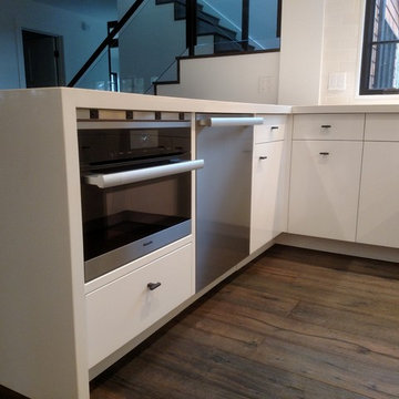Jackson NH Modern High Gloss Kitchen with Quartz Waterfall Penninsula