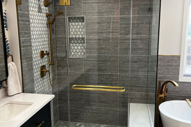 Example of a large trendy master gray tile and porcelain tile porcelain tile, white floor, double-sink, wallpaper ceiling and wallpaper bathroom design in Chicago with flat-panel cabinets, blue cabinets, a two-piece toilet, beige walls, an undermount sink, quartz countertops, a hinged shower door, beige countertops, a niche and a freestanding vanity