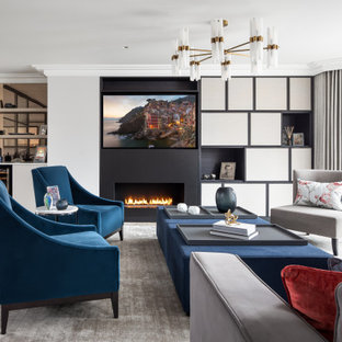 Inspiration for a traditional enclosed living room in Kent with a home bar, white walls, light hardwood flooring, a ribbon fireplace, a wall mounted tv and beige floors.