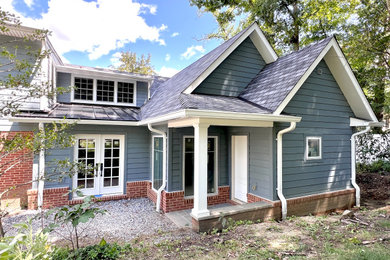 Inspiration for a huge craftsman blue one-story concrete fiberboard and clapboard exterior home remodel in Baltimore with a mixed material roof and a black roof