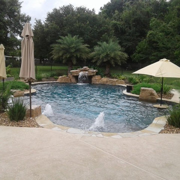 Freeform, natural pool with bubblers, tanning ledge, loveseat grotto, bookend ri