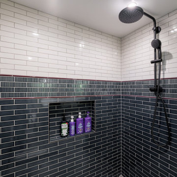 Spacious Walk-In Shower with Two-Tone Subway Tile and Matte Black Fixtures