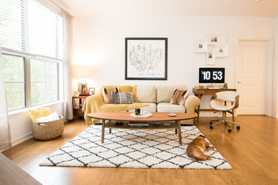 Living room - large contemporary open concept medium tone wood floor and beige floor living room idea in Orange County with white walls, no fireplace and a tv stand