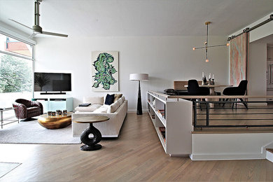 Inspiration for a large contemporary formal and open concept light wood floor living room remodel in Orange County with white walls, a standard fireplace, a concrete fireplace and no tv