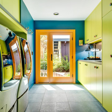 Green and Blue Laundry/Mud Room with Back Yard Access