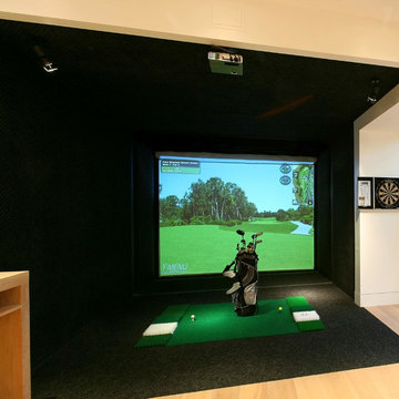 Fabulous golf simulator, forming part of this larger basement conversion