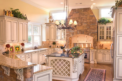 Enclosed kitchen - large traditional u-shaped medium tone wood floor and brown floor enclosed kitchen idea in Atlanta with a double-bowl sink, shaker cabinets, white cabinets, granite countertops, beige backsplash, ceramic backsplash, stainless steel appliances and an island