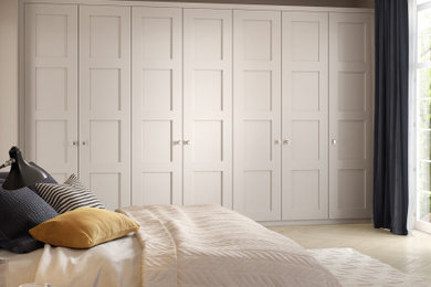 Photo of a medium sized classic standard wardrobe in Manchester with shaker cabinets, grey cabinets, medium hardwood flooring and brown floors.