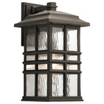Kichler - Outdoor Wall 1-Light - Inspired by classic craftsman architecture, this Beacon Square 17.5" 1 light outdoor wall lantern's clean lines deliver a transitional and versatile style. Crafted from Kichler's Climates materials, each fixture is designed to withstand harsh outdoor elements, like saltwater spray and UV rays, for a beautiful and long-lasting Olde Bronze finish. The clear, hammered glass simulates the look of water, enhancing the overall style, while still letting the light shine through.