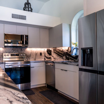 Matte Ivory Kitchen Remodel with Leathered Granite in Ahwautukee, AZ