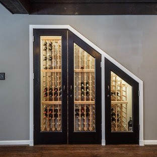 Design ideas for an expansive traditional walk-out basement in DC Metro with grey walls.