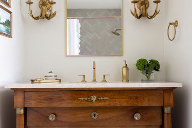 Inspiration for a large traditional bathroom in Houston with medium wood cabinets, white tiles, white walls, white floors, a freestanding vanity unit, an alcove bath, a two-piece toilet, marble flooring, a submerged sink, quartz worktops, a shower curtain, white worktops, a single sink, a shower/bath combination and stone tiles.