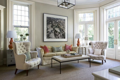 This is an example of a large transitional formal open concept living room in DC Metro with beige walls and carpet.