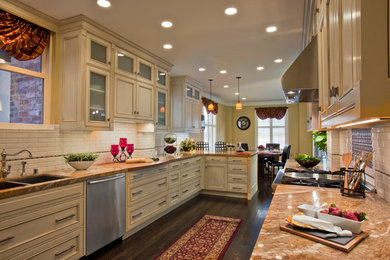 Inspiration for a mid-sized timeless galley dark wood floor eat-in kitchen remodel in San Francisco with a double-bowl sink, beige cabinets, granite countertops, white backsplash, stainless steel appliances, no island, porcelain backsplash and recessed-panel cabinets