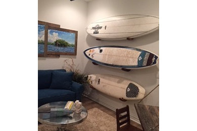 Small beach style enclosed medium tone wood floor family room photo in Miami with beige walls, no fireplace and no tv