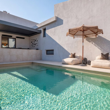 Swimming pool with white house façade, Alfragide