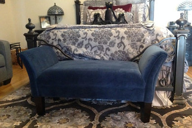 Ornate iron bed and "kitty" bench