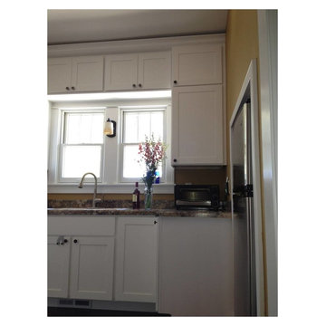 Shaker Style White kitchen - renovated flooded home in N.D.