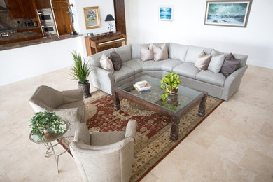 Inspiration for a mid-sized transitional open concept limestone floor living room remodel in San Diego with white walls, no fireplace and no tv