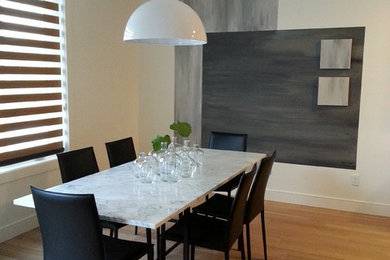 Example of a trendy dining room design in Calgary