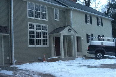 Inspiration for a mid-sized timeless gray two-story mixed siding exterior home remodel in Philadelphia