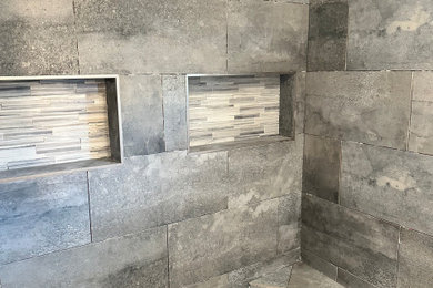 Bathroom - small rustic 3/4 blue tile and porcelain tile pebble tile floor and white floor bathroom idea in Orange County with a niche