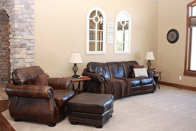 Inspiration for a mid-sized craftsman open concept carpeted and beige floor living room remodel in Denver with beige walls and no fireplace