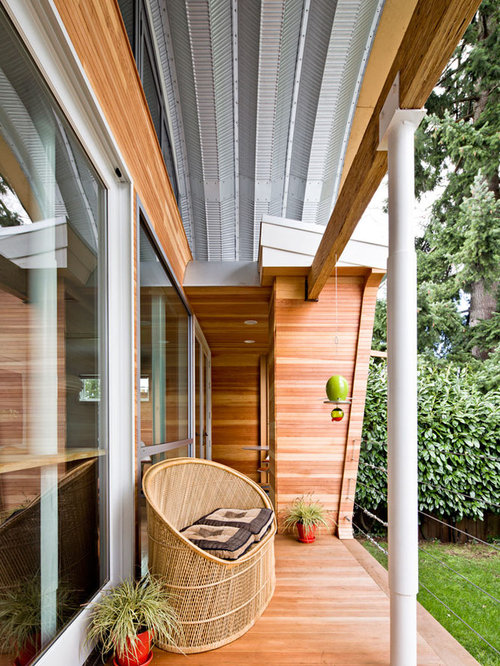 This is an example of an eclectic porch design in Portland with decking and a roof Eclectic Porch Portland Eclectic Porch Portland This is an example of an eclectic porch design in Portland with decking and a roof