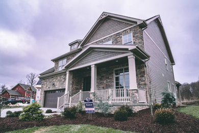 Inspiration for a mid-sized craftsman brown two-story concrete fiberboard exterior home remodel in Other with a shingle roof