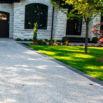 Landscaping the Whole House with Both Interlocking Pavers and Exposed Concrete