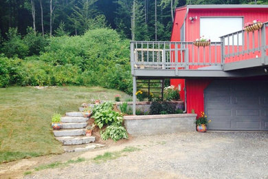 Inspiration for a mid-sized transitional partial sun backyard gravel landscaping in Boston for summer.
