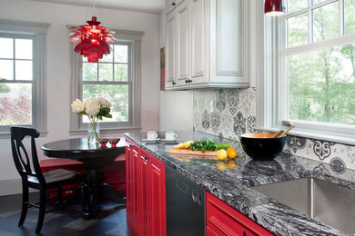 Eat-in kitchen - mid-sized eclectic l-shaped linoleum floor eat-in kitchen idea in Boston with an undermount sink, raised-panel cabinets, red cabinets, granite countertops, ceramic backsplash, stainless steel appliances, no island and gray backsplash