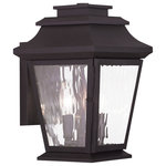Livex Lighting - Hathaway Outdoor Wall Lantern, Bronze - This outdoor wall lantern light looks great near garage doors, entryways, and porches. Our handsome bronze finish is paired with clear water glass and durable solid brass construction for a classic look and feel that works with any home. Candelabra bulbs offer a warm, soft glow, so you can feel both safe and stylish.