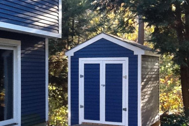 This is an example of a small classic detached garden shed and building.