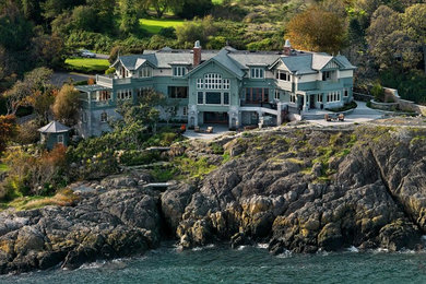 Inspiration for a huge craftsman green three-story wood exterior home remodel in Vancouver