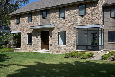 Design ideas for a transitional exterior in Detroit with stone veneer.