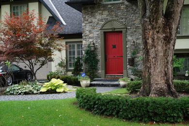 Design ideas for a mid-sized traditional partial sun front yard concrete paver landscaping in Toronto.