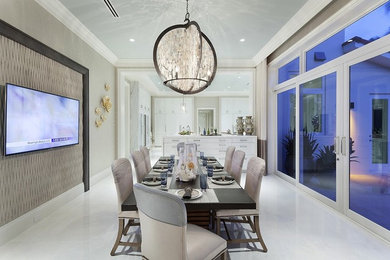 Minimalist white floor kitchen/dining room combo photo in Miami