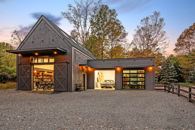 Garage workshop - large farmhouse detached three-car garage workshop idea in New York
