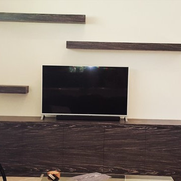 entertainment console in re constituted, dyed, zebra wood veneer