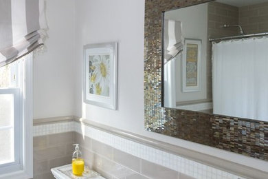 Inspiration for a mid-sized transitional master gray tile and subway tile porcelain tile and white floor bathroom remodel in New York with shaker cabinets, dark wood cabinets, a one-piece toilet, gray walls, an integrated sink and solid surface countertops