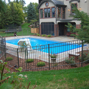 Bluestone pool decks, arbors, fireplaces, outdoor kitchen & pavilion