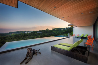Inspiration for a contemporary tile and rectangular pool remodel in Atlanta