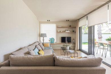 Living room - large mediterranean open concept light wood floor living room idea in Other with white walls and a corner tv