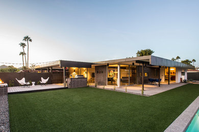 Mid-sized 1960s gray one-story concrete flat roof photo in Phoenix