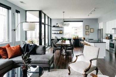 Small transitional dark wood floor and brown floor living room photo in Raleigh with gray walls