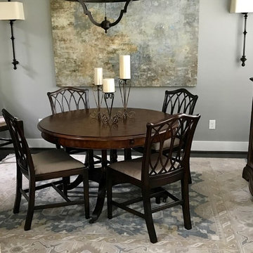 Oushak brings a relaxed atmosphere to this dining room space...artistic...