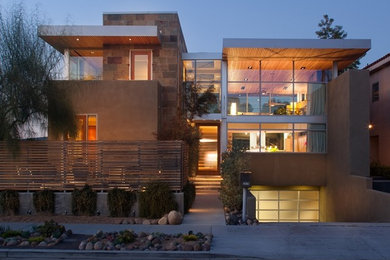 Mid-sized contemporary brown two-story stone exterior home idea in Houston