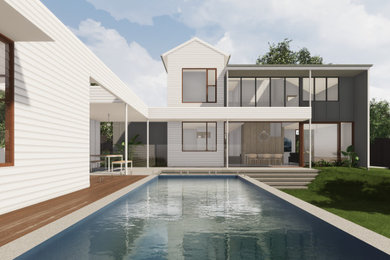 Large contemporary two-storey white house exterior in Brisbane with wood siding, a hip roof and a metal roof.